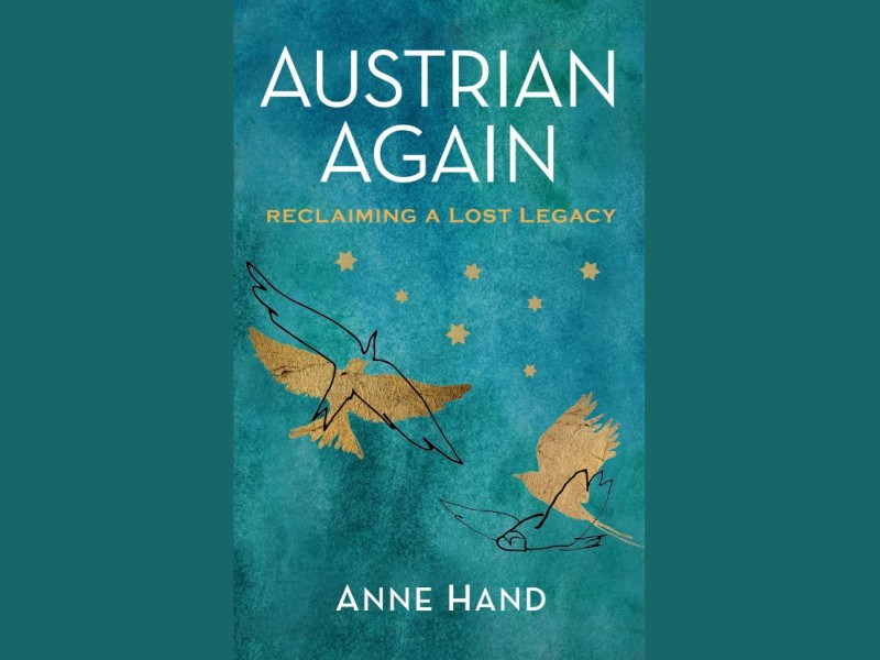 Two stylized birds and seven gold stars on a turquoise background with the title 'AUSTRIAN AGAIN RECLAIMING A LOST LEGACY' and the name 'ANNE HAND'.